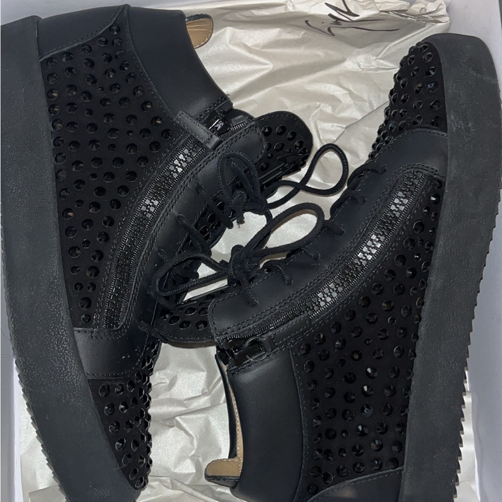 Black High-Top Sneakers with Intricate Perforated Pattern and Thick Rubber Sole